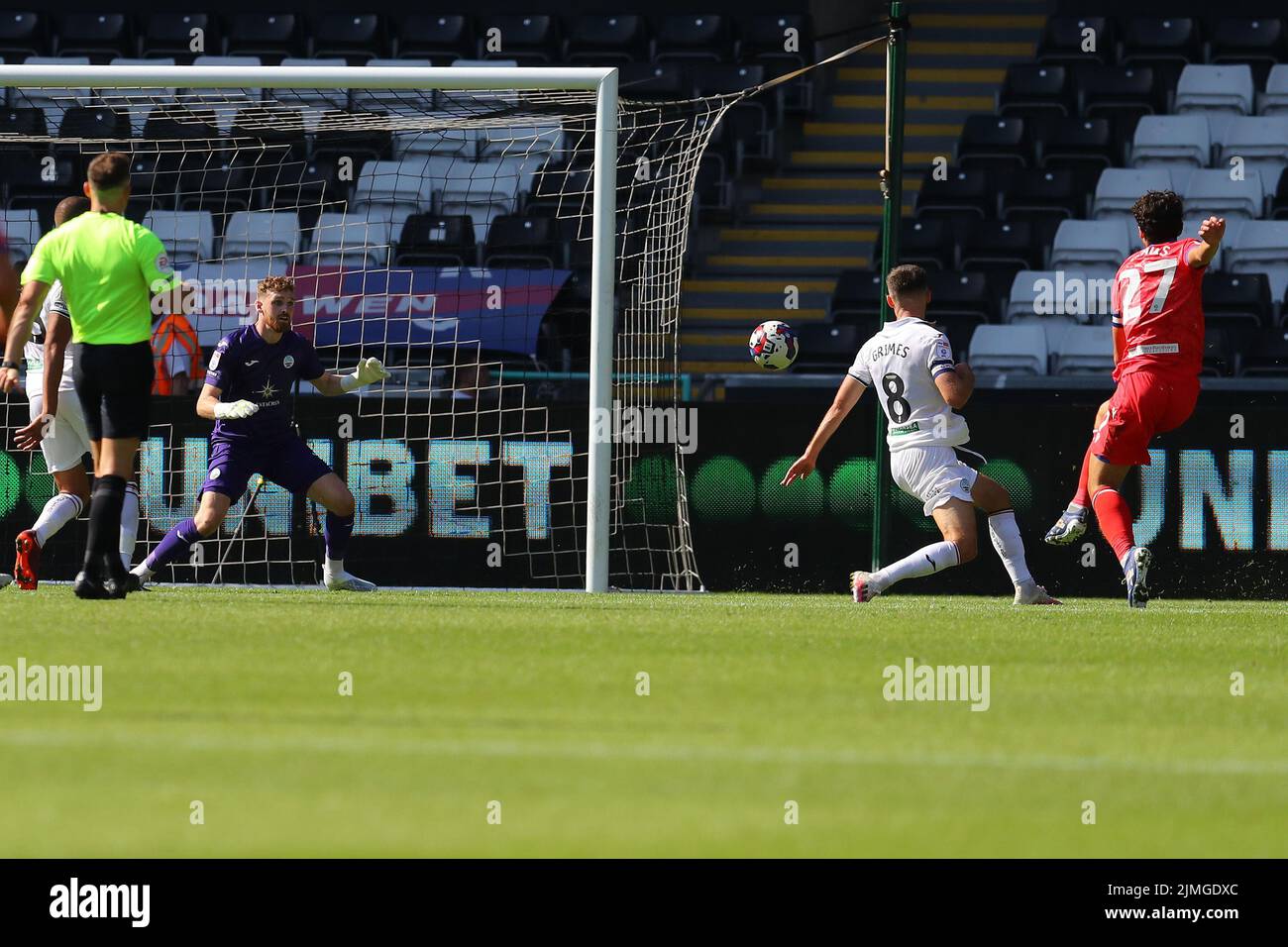 Swansea, UK. 06th Aug, 2022. Lewis Travis of Blackburn Rovers (r) beats Swansea city goalkeeper Andy Fisher as he scores his teams 3rd goal. EFL Skybet championship match, Swansea city v Blackburn Rovers at the Swansea.com Stadium in Swansea, Wales on Saturday 6th August 2022. this image may only be used for Editorial purposes. Editorial use only, license required for commercial use. No use in betting, games or a single club/league/player publications. pic by Andrew Orchard/Andrew Orchard sports photography/Alamy Live news Credit: Andrew Orchard sports photography/Alamy Live News Stock Photo