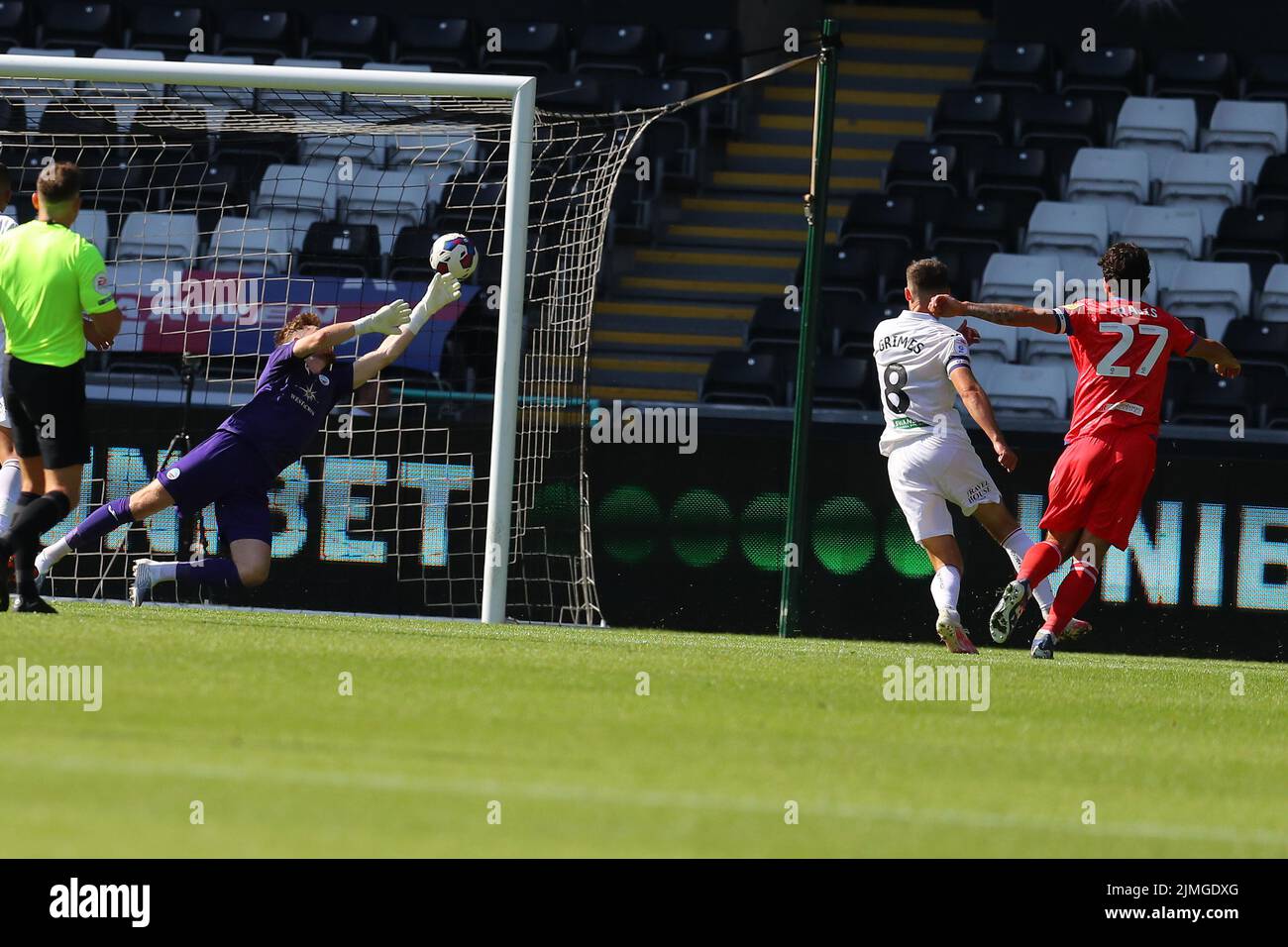 Swansea, UK. 06th Aug, 2022. Lewis Travis of Blackburn Rovers (r) beats Swansea city goalkeeper Andy Fisher as he scores his teams 3rd goal. EFL Skybet championship match, Swansea city v Blackburn Rovers at the Swansea.com Stadium in Swansea, Wales on Saturday 6th August 2022. this image may only be used for Editorial purposes. Editorial use only, license required for commercial use. No use in betting, games or a single club/league/player publications. pic by Andrew Orchard/Andrew Orchard sports photography/Alamy Live news Credit: Andrew Orchard sports photography/Alamy Live News Stock Photo