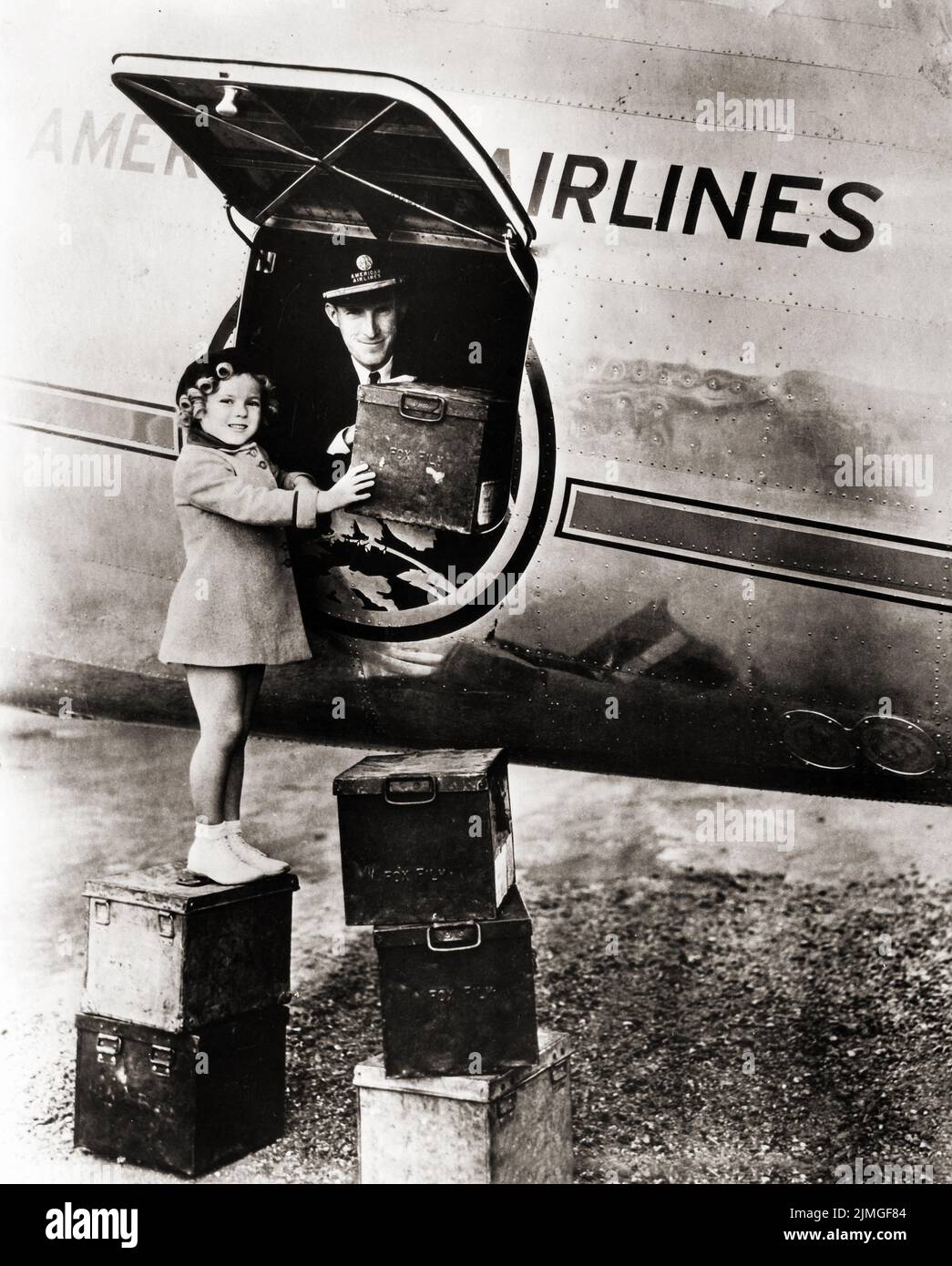 A photo of Shirley Temple boarding an American Airlines DC-3 plane in the early to mid 1930's. Stock Photo