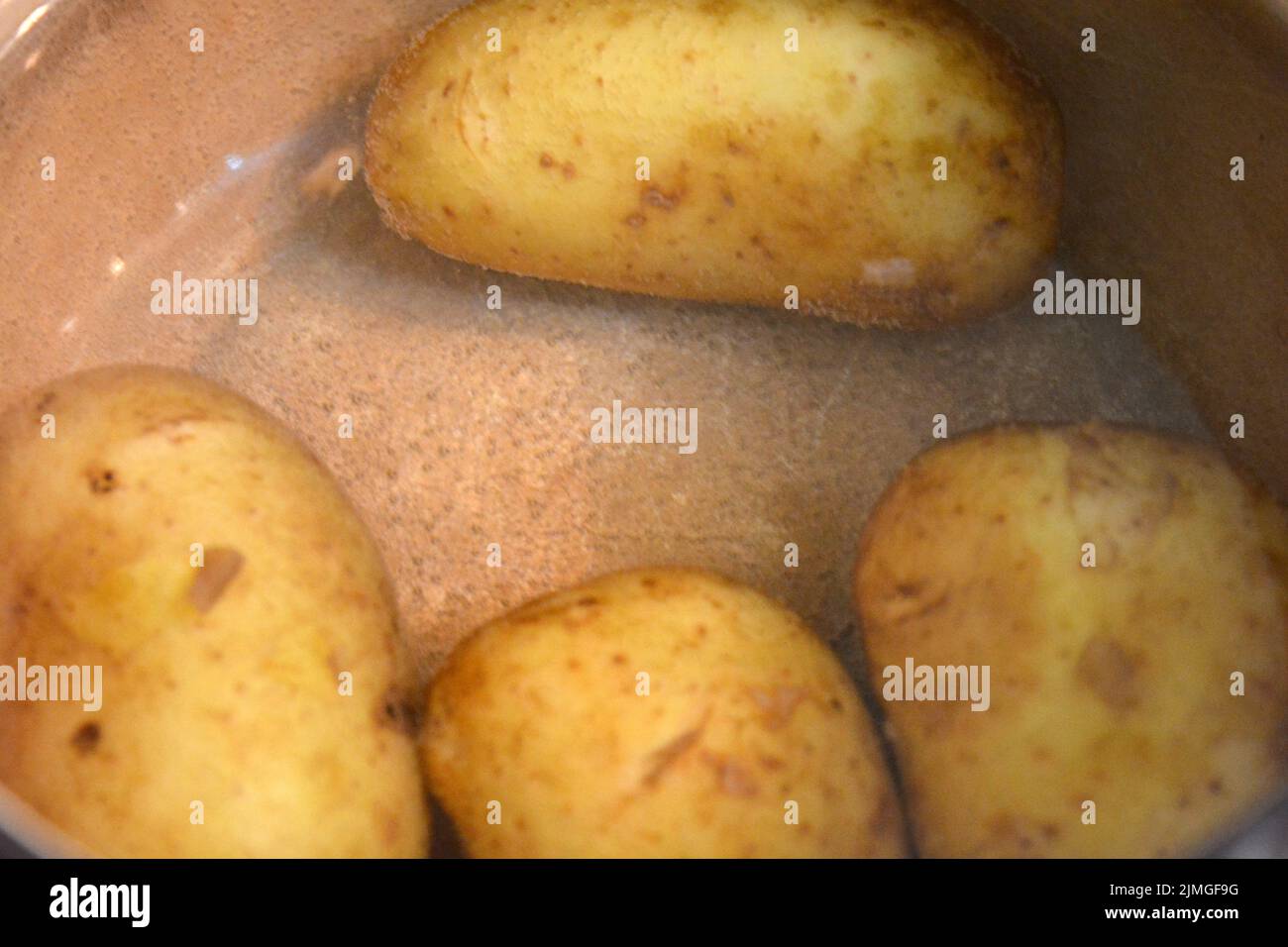 Delicious Polish young potatoes boiled in a saucepan Stock Photo Alamy
