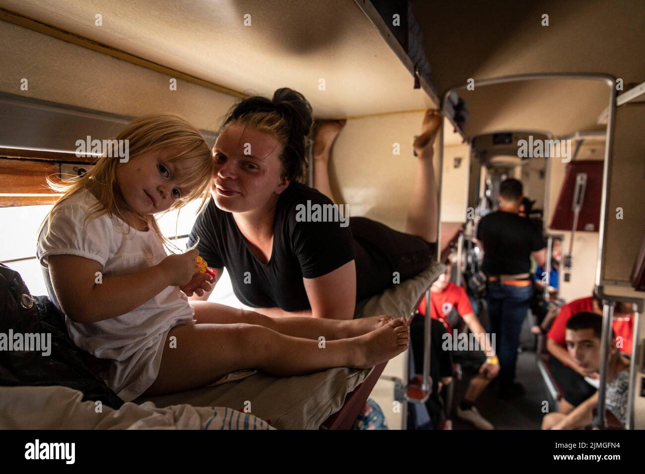 A mother and her daughter seen inside an evacuation train at Pokorvsk Train Station, Donetsk. Amid the intensified fighting in the Eastern part of Ukraine, east Ukraine is now intensifying its civilian evacuation, as millions of Ukrainian families have been evacuating from the closer and closer war, as many of them will be relocated to the western part of the country. According to the United Nations, at least 12 million people have fled their homes since Russia's invasion of Ukraine, while seven million people are displaced inside the country. Stock Photo
