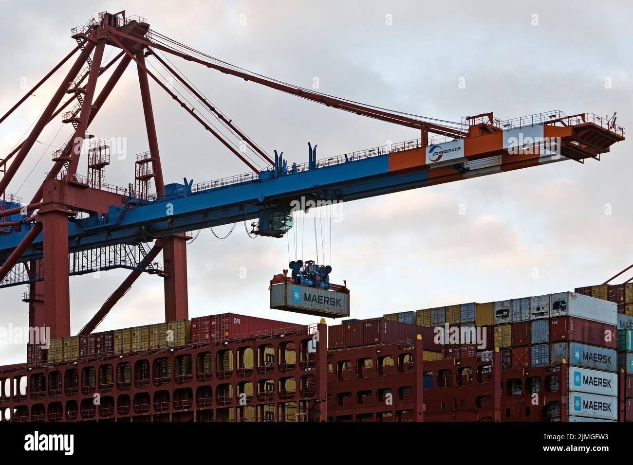 Container being loaded onto a container ship at the Eurogate container terminal, Hamburg, Germany Stock Photo