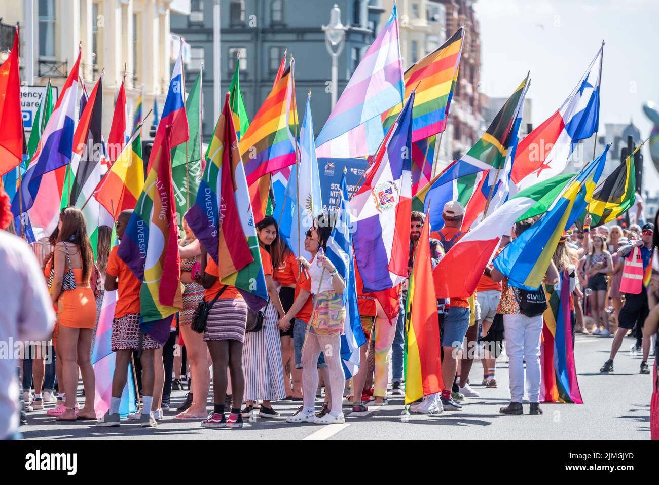 Brighton, August 6th 2022: people getting ready at the start of the parade for the UK's most popular Pride event in Brighton, this year celebrating its 30th anniversary and the first post-pandemic Pride march in the city Stock Photo