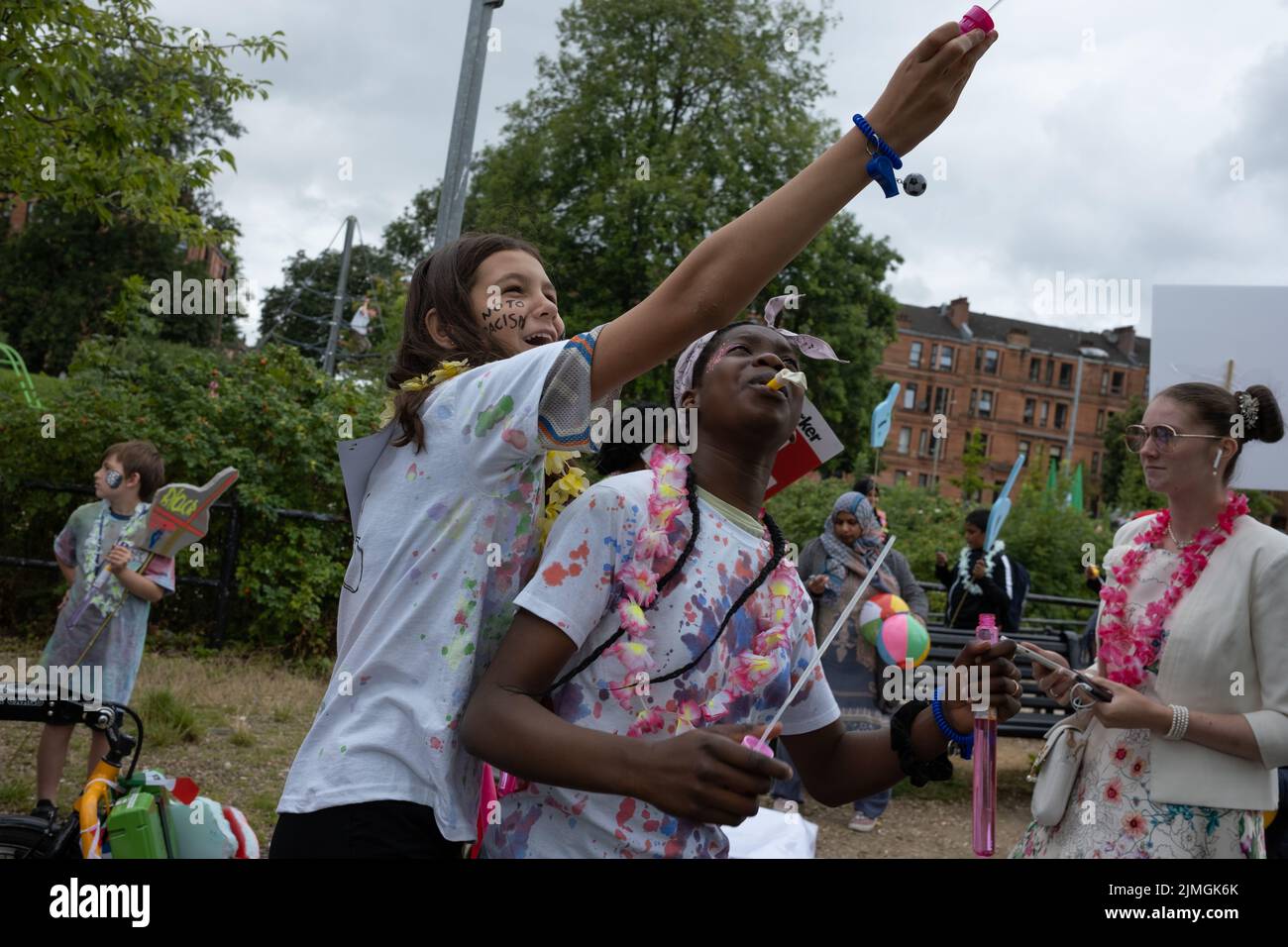 Glasgow, UK, 6th August 2022. The parade at the beginning of the Govanhill International Festival and Carnival, in Glasgow, Scotland, 6 August 2022. Photo credit: Jeremy Sutton-Hibbert/Alamy Live News Stock Photo