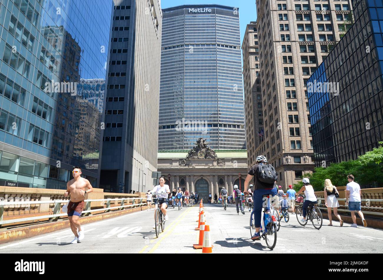 New Yorkers are seen walking and biking around Park Avenue during car free “Summer Streets” along Park Avenue in New York City. Stock Photo