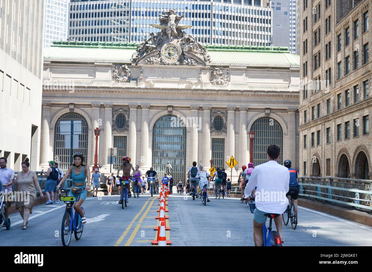 New Yorkers are seen biking on Park Avenue near Grand Central during car free “Summer Streets” along Park Avenue in New York City. Stock Photo