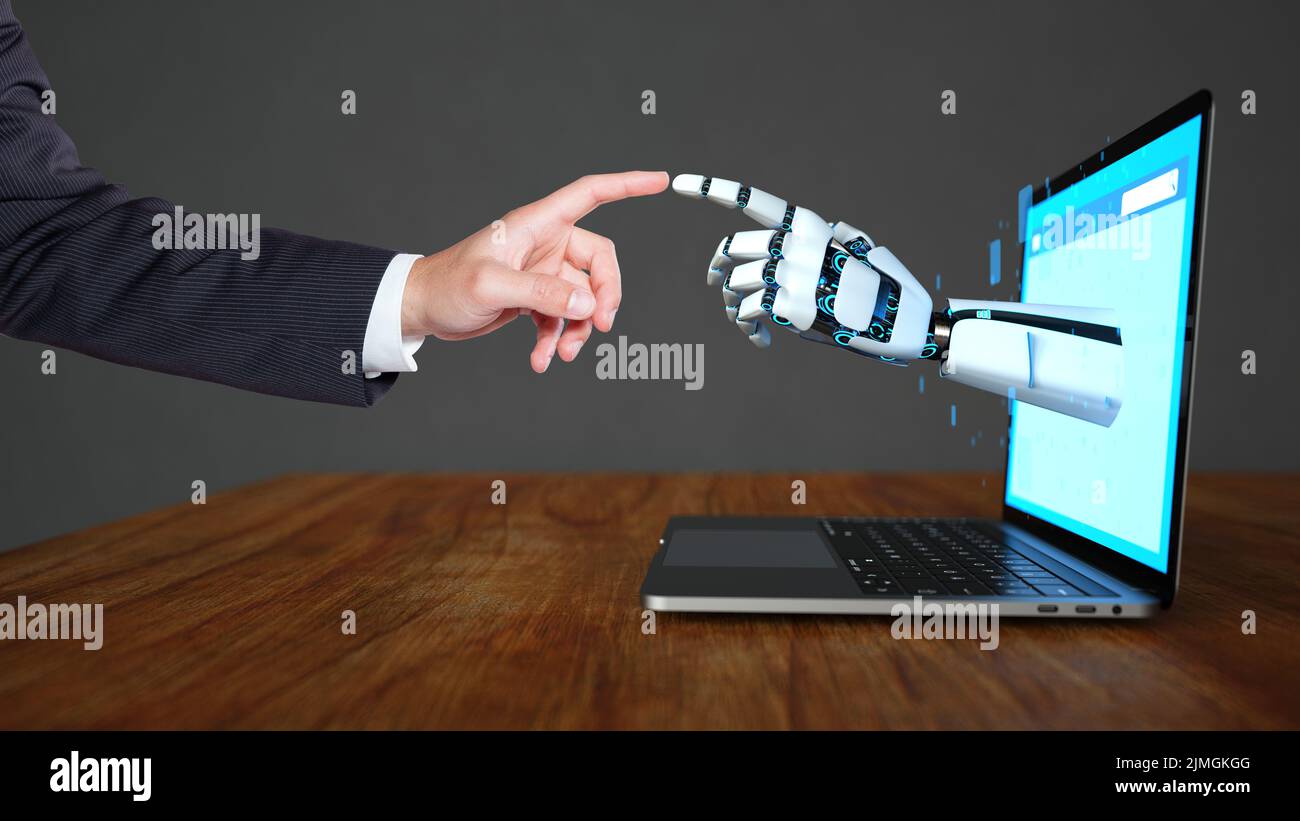 RS Roboter Hand Geschaeftsmann Macbook Kontakt.jpg Stock Photo
