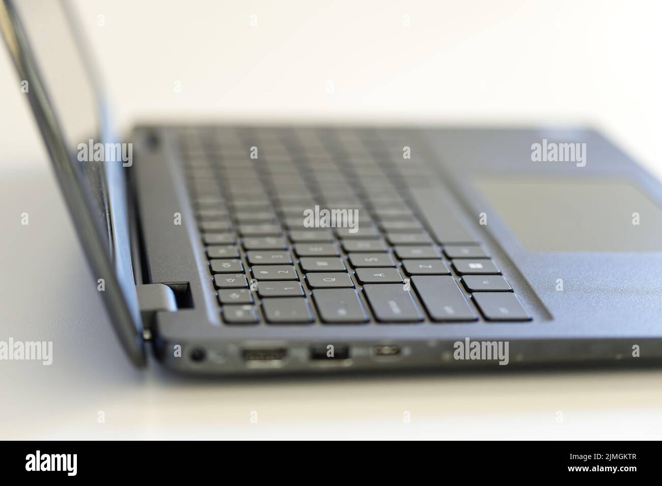 Laptop on white background, shallow depth of field. Stock Photo