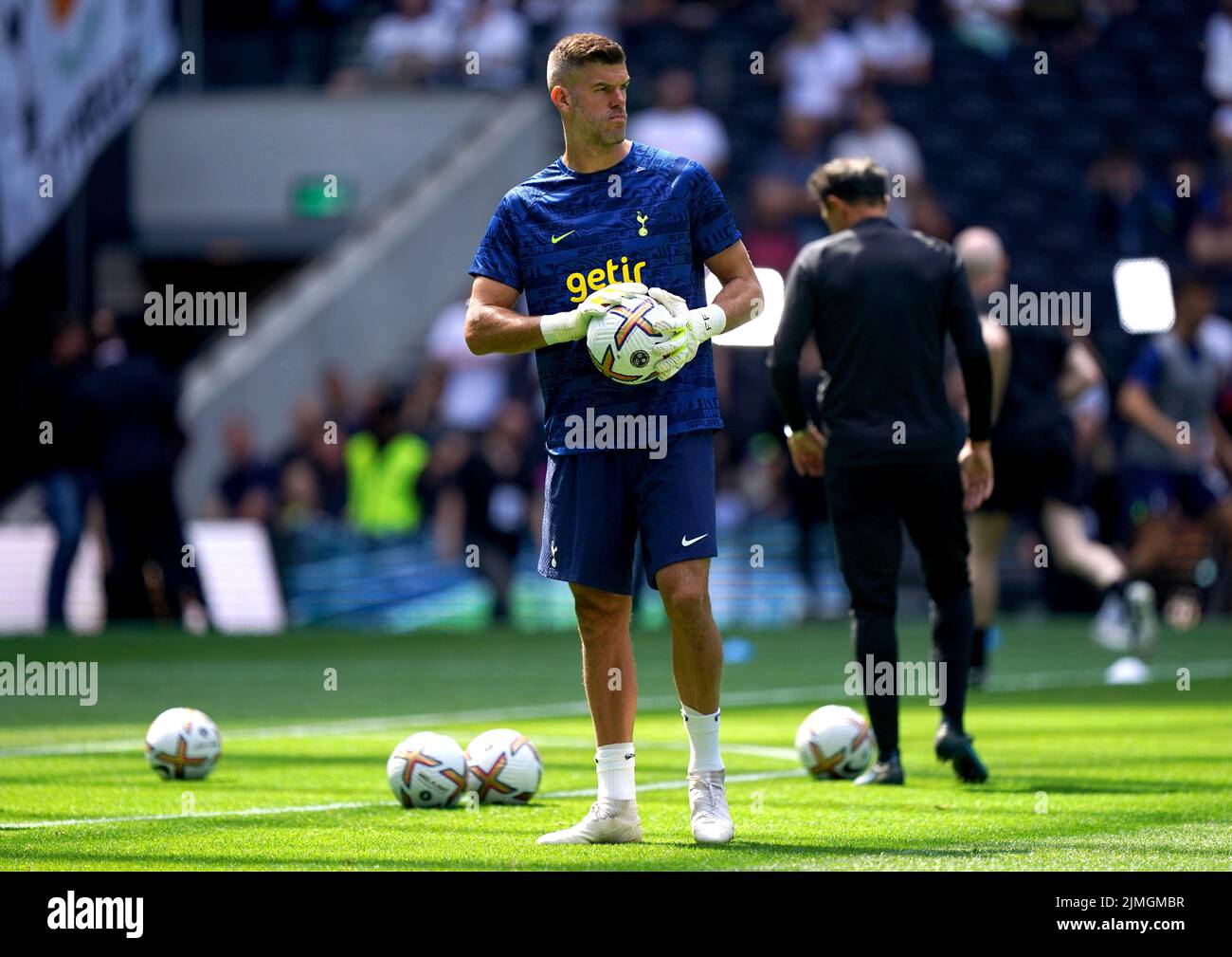 Tottenham Hotspur goalkeeper Fraser Forster warms up on the pitch ahead of the Premier League match at Tottenham Hotspur Stadium, London. Picture date: Saturday August 6, 2022. Stock Photo