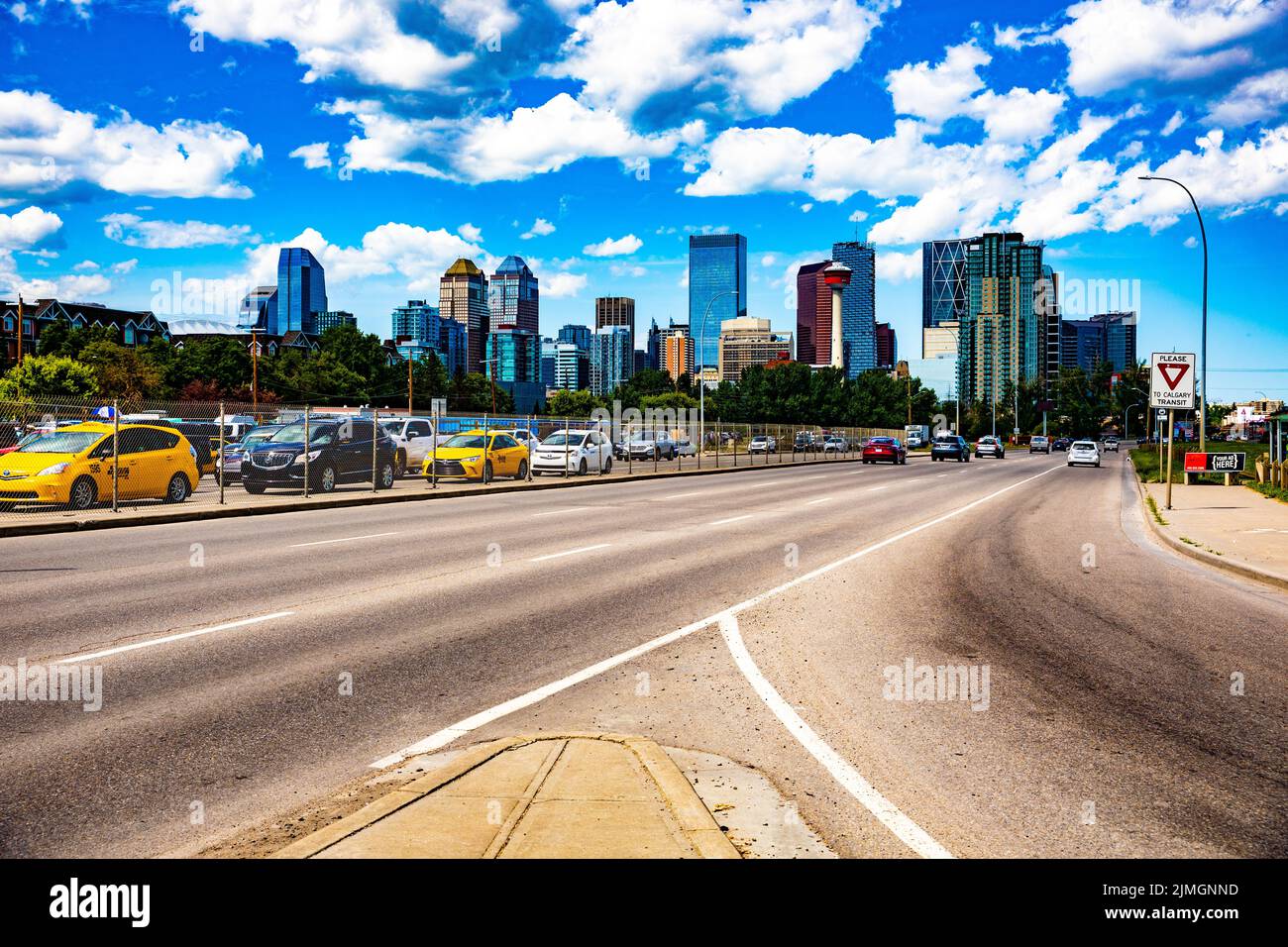 A vibrant cityscape of downtown Calgary in Alberta, Canada, against the bright cloudy sky Stock Photo