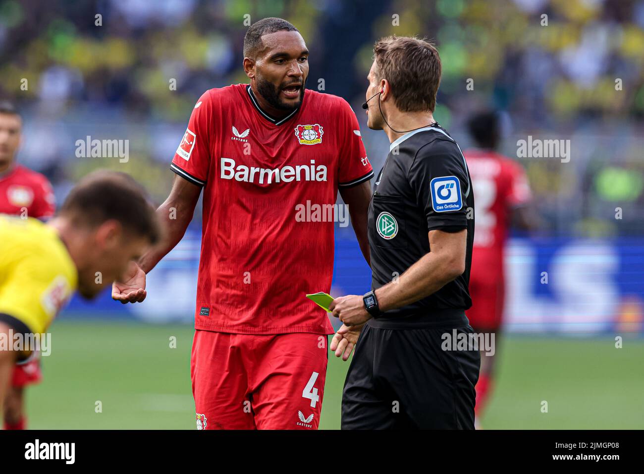 DORTMUND, GERMANY AUGUST 6 Jonathan Tah of Bayer Leverkusen receives