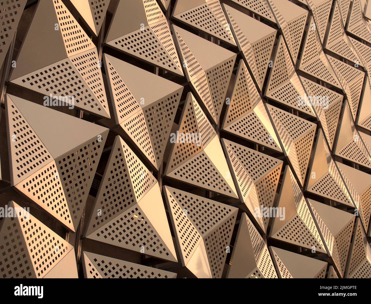 Metallic geometric cladding or panels in copper and gold colors Stock Photo