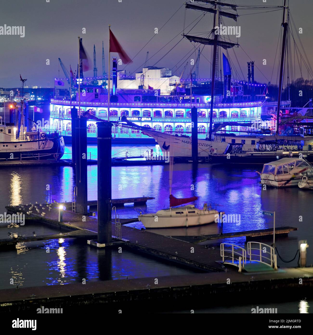 Blue illuminated passenger ship Lousianna Star at the City Sporthafen at night, Hamburg, Germany Stock Photo