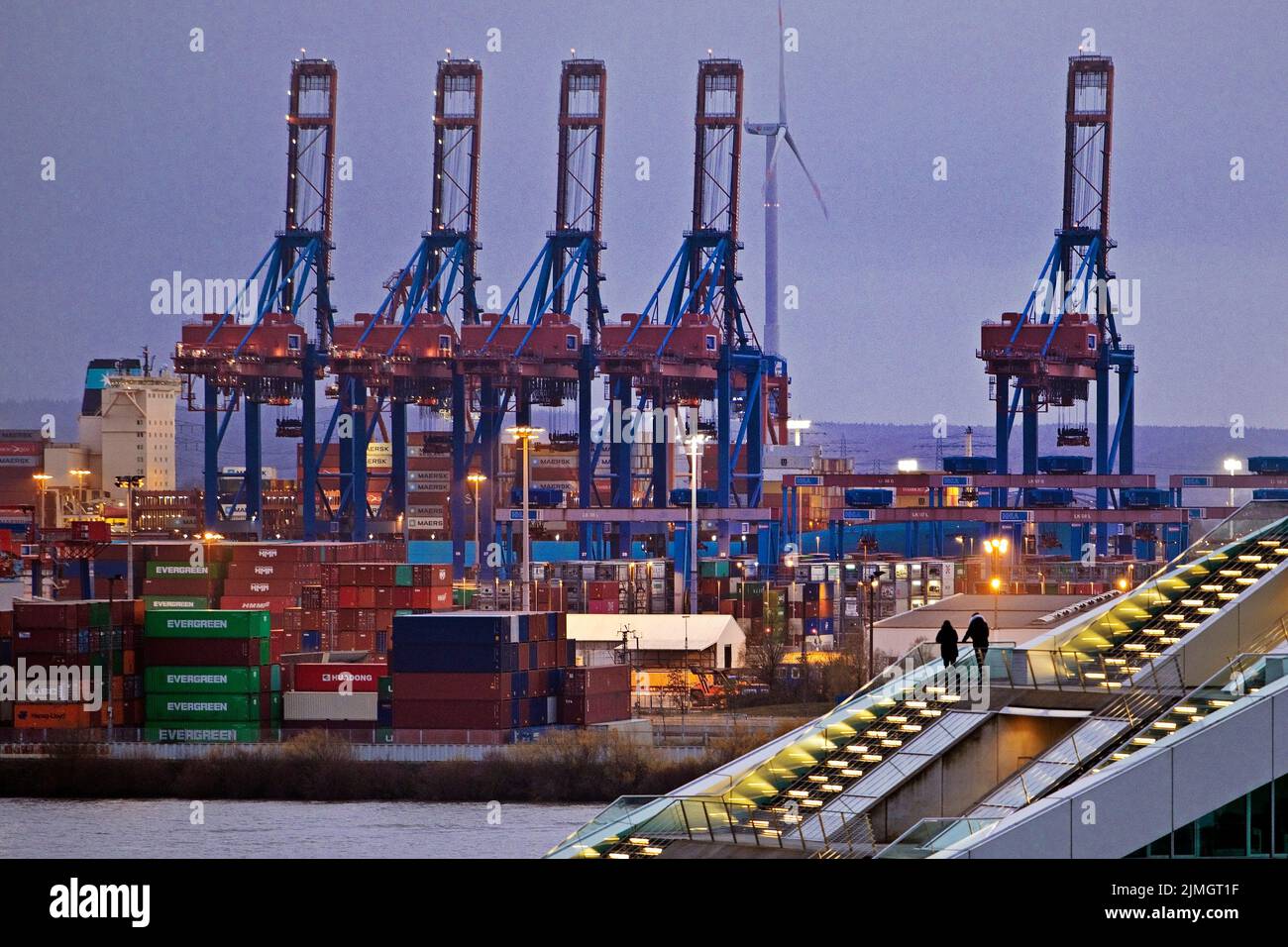 Loading cranes at the Burchardkai container terminal with people at Dockland, Hamburg, Germany Stock Photo