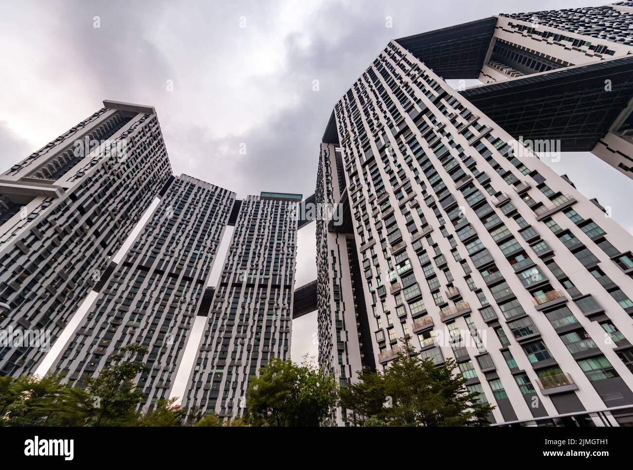 Bottom view of real estate housing in down town of Singapore, skyscraper at cloud weather Stock Photo