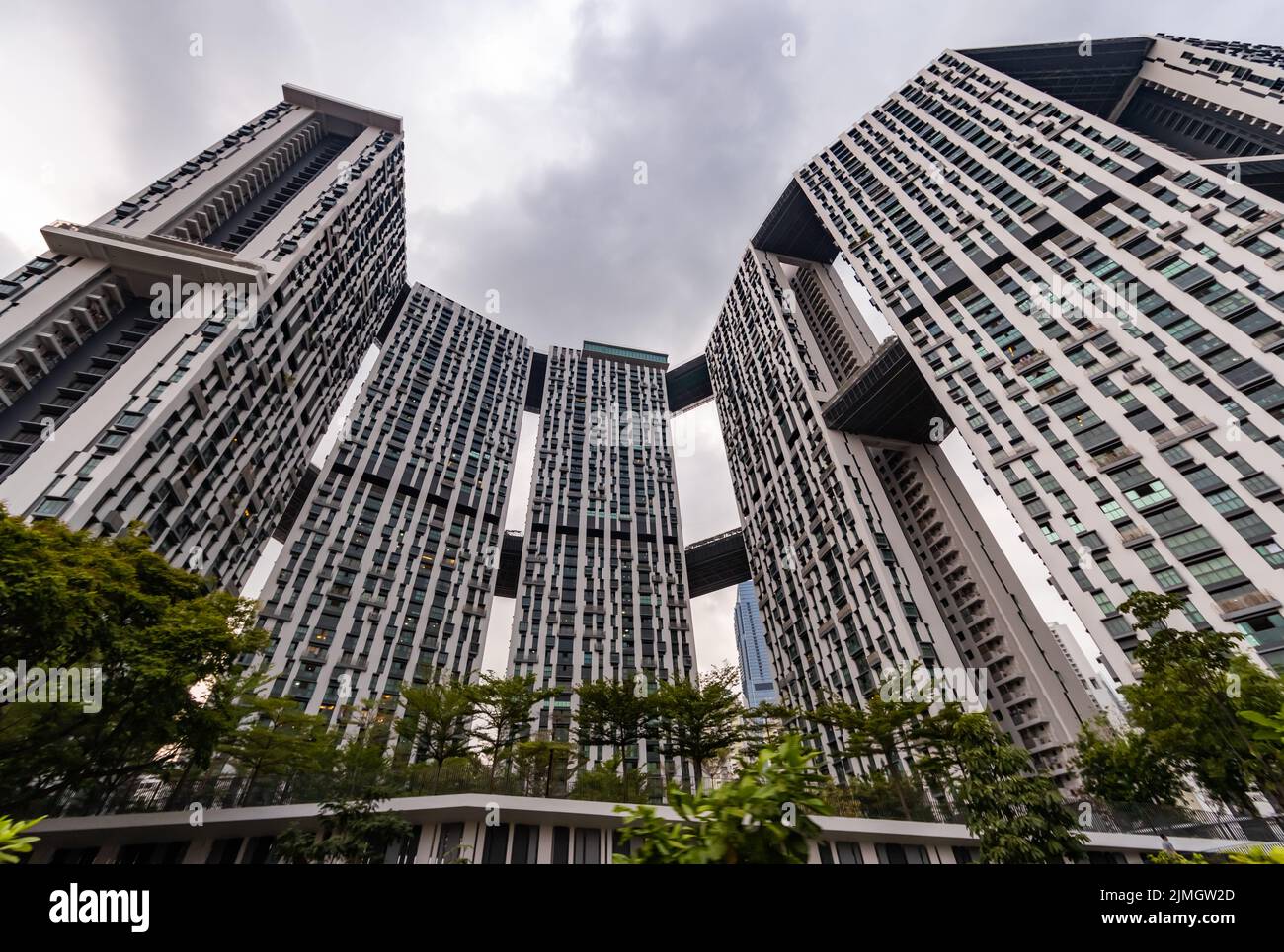 Bottom view of real estate housing in down town of Singapore, skyscraper at cloud weather Stock Photo