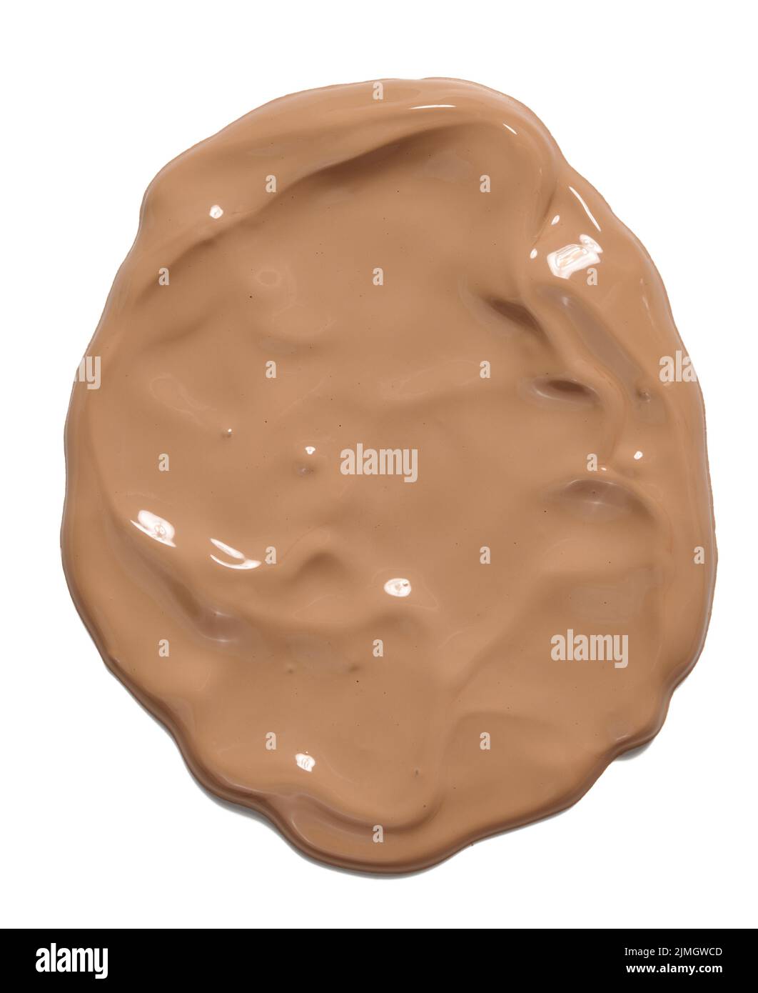 Sample of light brown face cream dripping down on white background Stock Photo