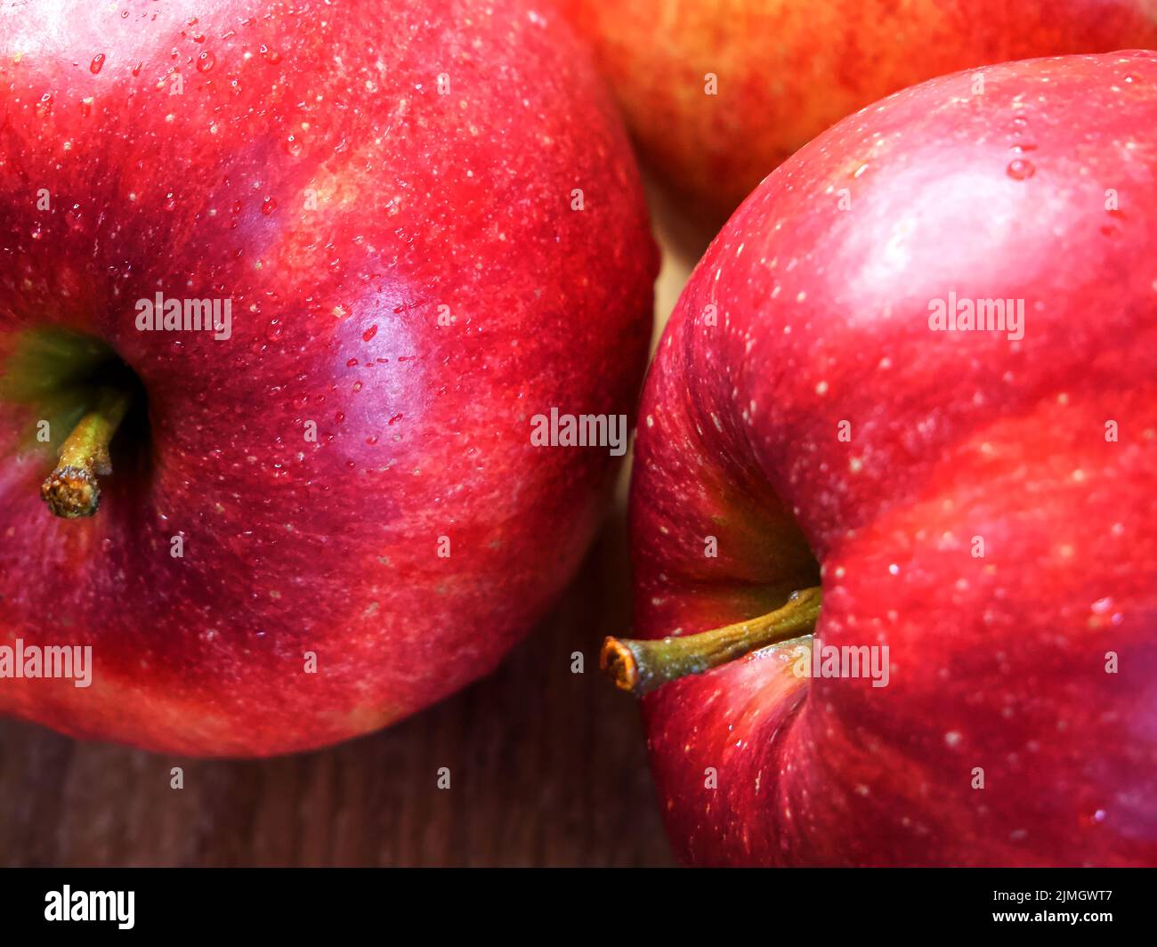 Delicious red apples photographed in macro. Juicy Red Apple Stock Photo