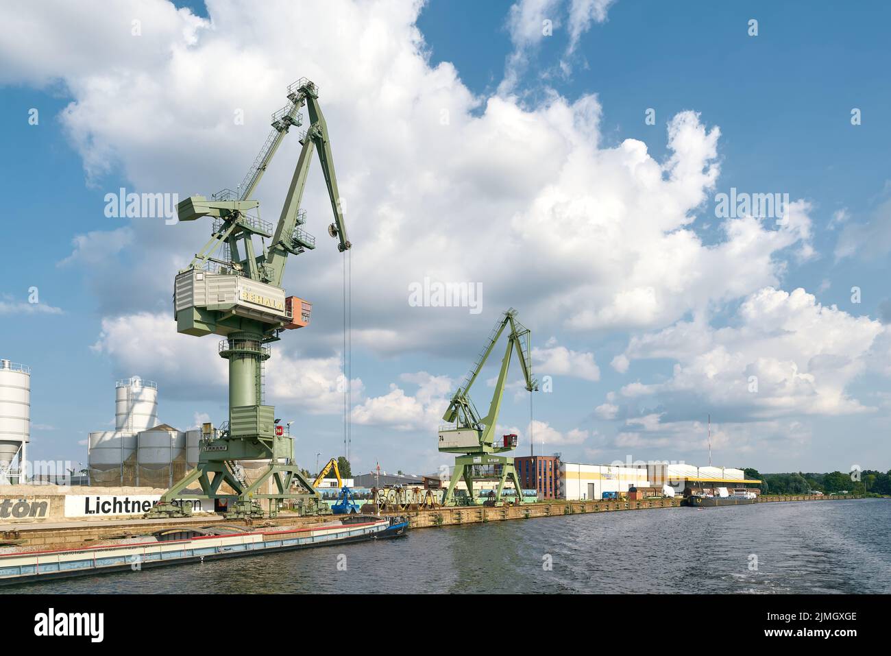 Cranes and industry in the southern harbor of the Berlin district of Spandau on the Havel River Stock Photo