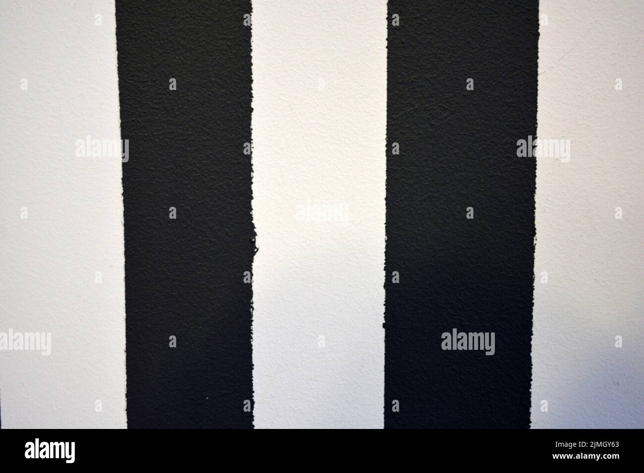 Graphic building background consisting of black and white stripes of