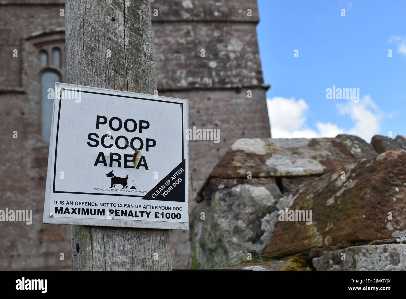 Sign: 'Poop Scoop Area' with copy space. Stock Photo