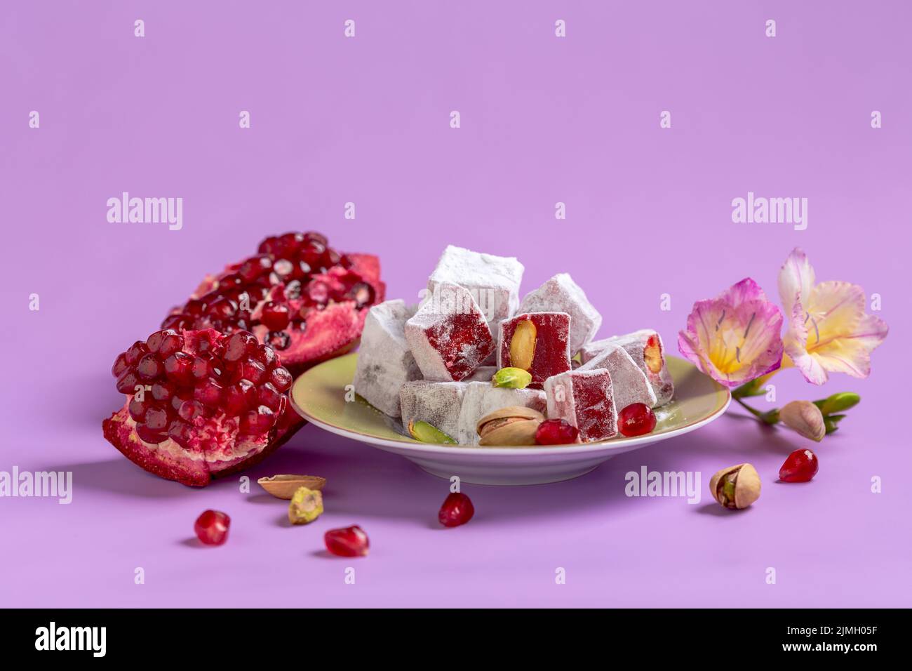 Turkish delight, pistachios and pomegranate. Stock Photo