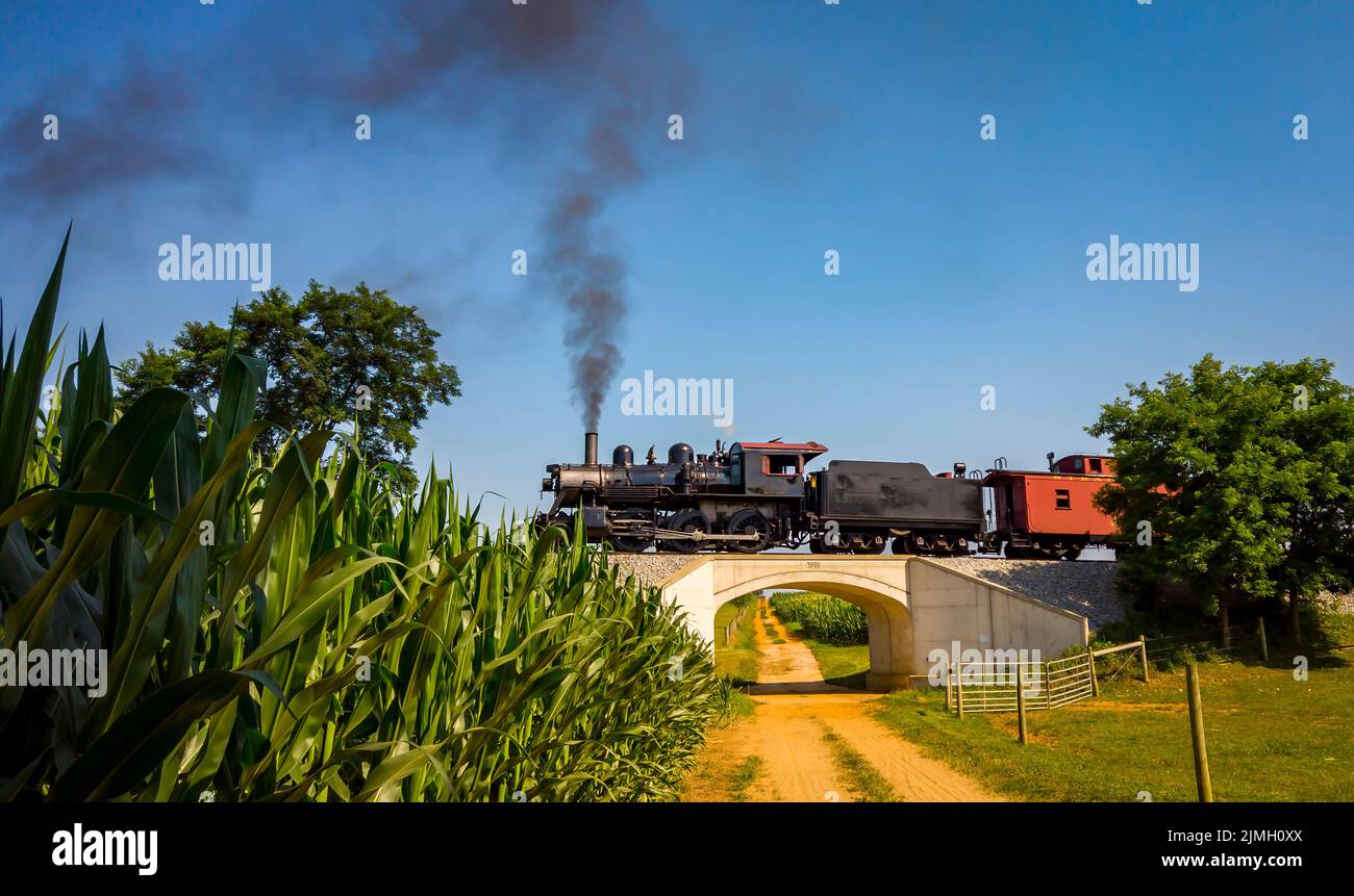 Lowered View of an Antique Restored Steam Engine and Caboose Stock