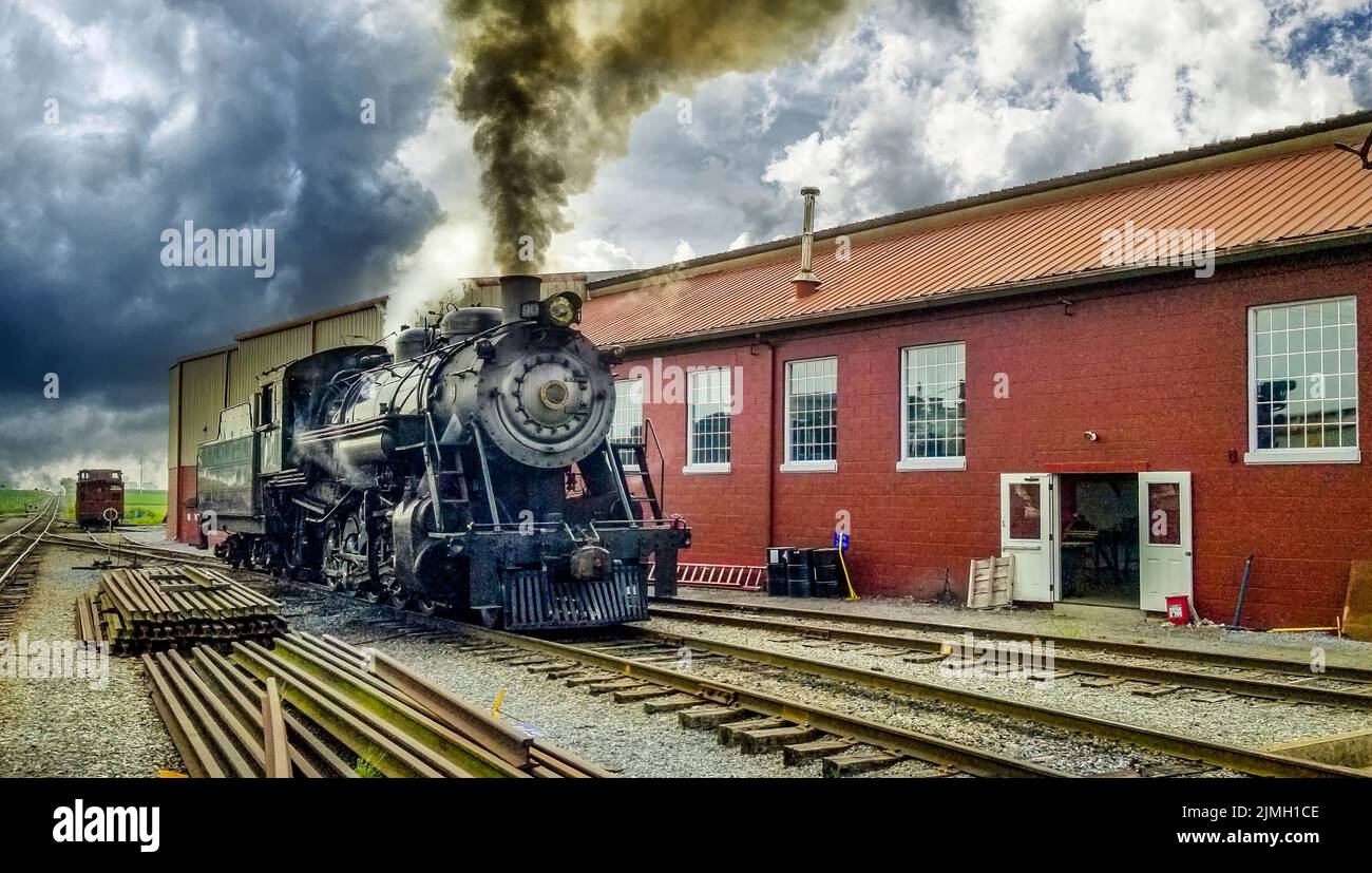 Restored Steam Engine Getting Ready for Service, Blowing Smoke and Steam Stock Photo Alamy