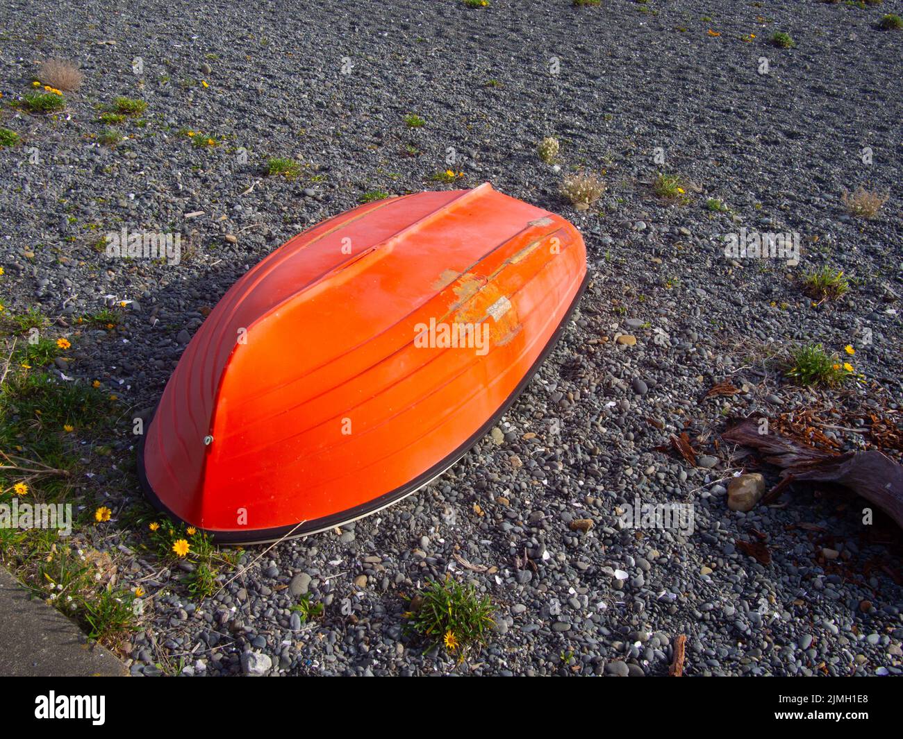 Upside Down Row Boat On The Beach Stock Photo