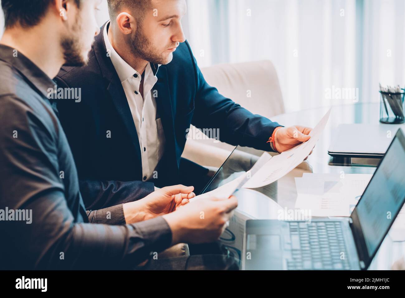 partnership cooperation business men report Stock Photo