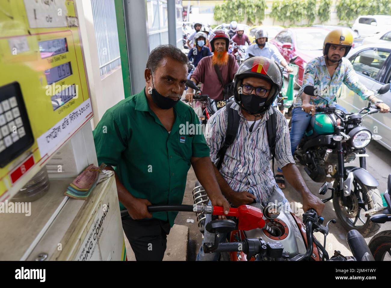Dhaka, Bangladesh. 6th Aug, 2022. A biker gets fuel at a gas station in