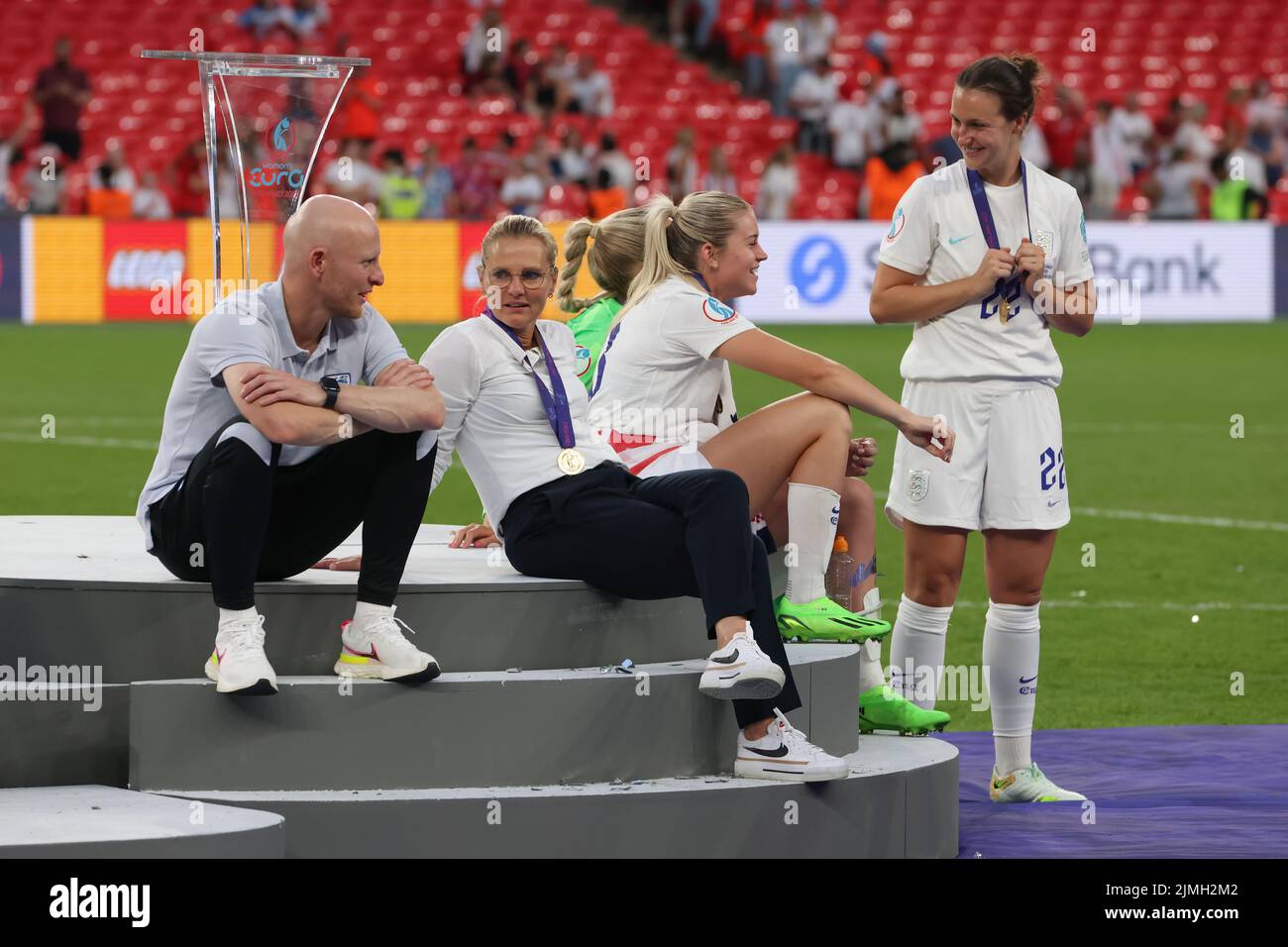 London, England, 31st July 2022. Sarina Wiegman Head coach of England discusses with Arjan Veurink Assistant coach of England likewise Alessia Russo with team mate Lotte Wubben-Moy of England  following the 2-1 victory in the UEFA Women's European Championship 2022 match at Wembley Stadium, London. Picture credit should read: Jonathan Moscrop / Sportimage Stock Photo