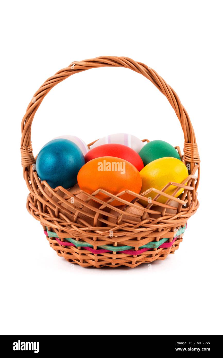 Easter eggs in a basket on a white background Stock Photo Alamy