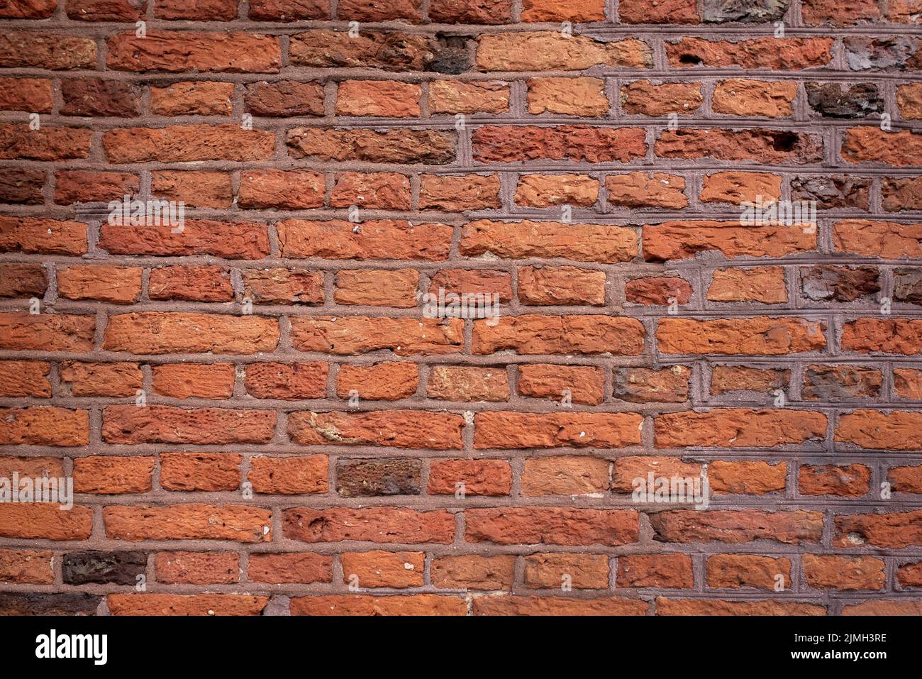Old brick wall background, brick wall texture. Old broken brick, cement
