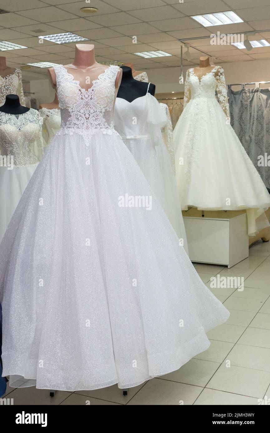 White wedding dresses in a bridal boutique. Copy space Stock Photo