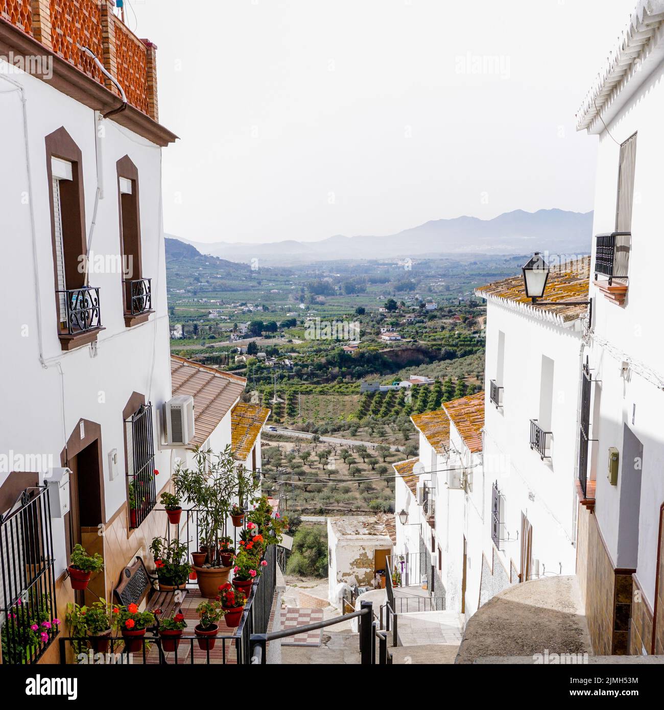 Narrow hillside street in the picturesque Andalusian village of Alora