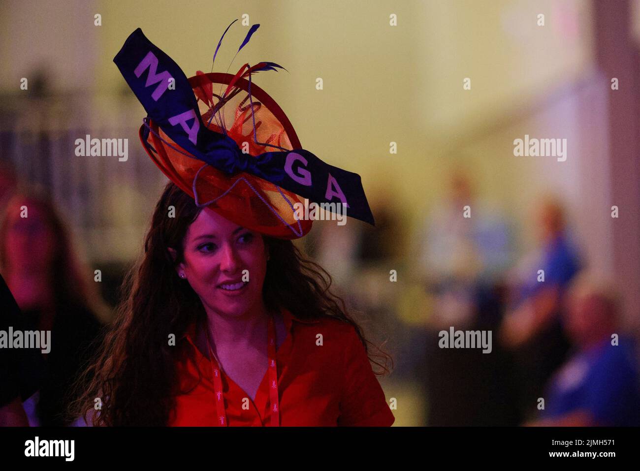 A attendee wears a hat with the initials 'MAGA' on the ribbon at the Conservative Political Action Conference (CPAC) in Dallas, Texas, U.S., August 6, 2022.  REUTERS/Brian Snyder Stock Photo