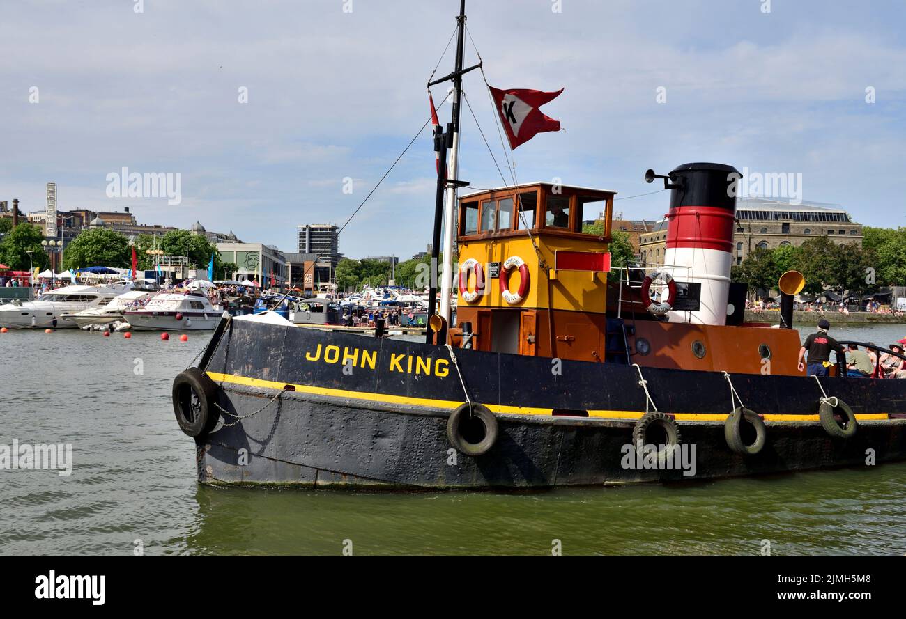 Historic Bristol built (1935 by Charles Hill & Sons Ltd.) steel hulled tug boat John King underway in Bristol bloating harbour during festival Stock Photo