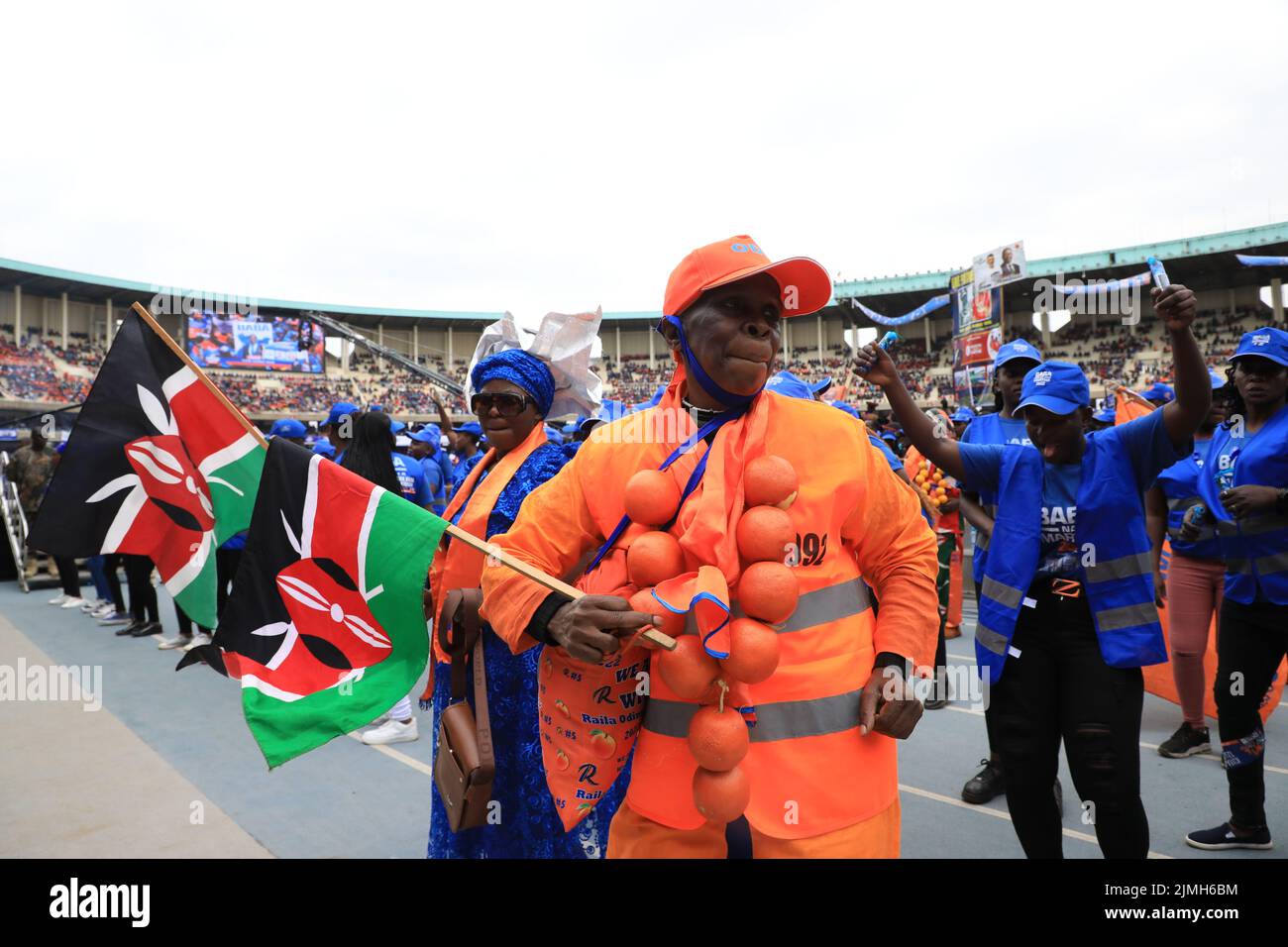 Nairobi, Kenya. 06th Aug, 2022. A supporter of Azimio la Umoja One Kenya presidential candidate Raila Odinga, dressed in orange is seen dancing during the final day of campaigns at the Kasarani Stadium in Nairobi. The August 9, 2022 general elections will be his fifth attempt at the presidency. Credit: SOPA Images Limited/Alamy Live News Stock Photo