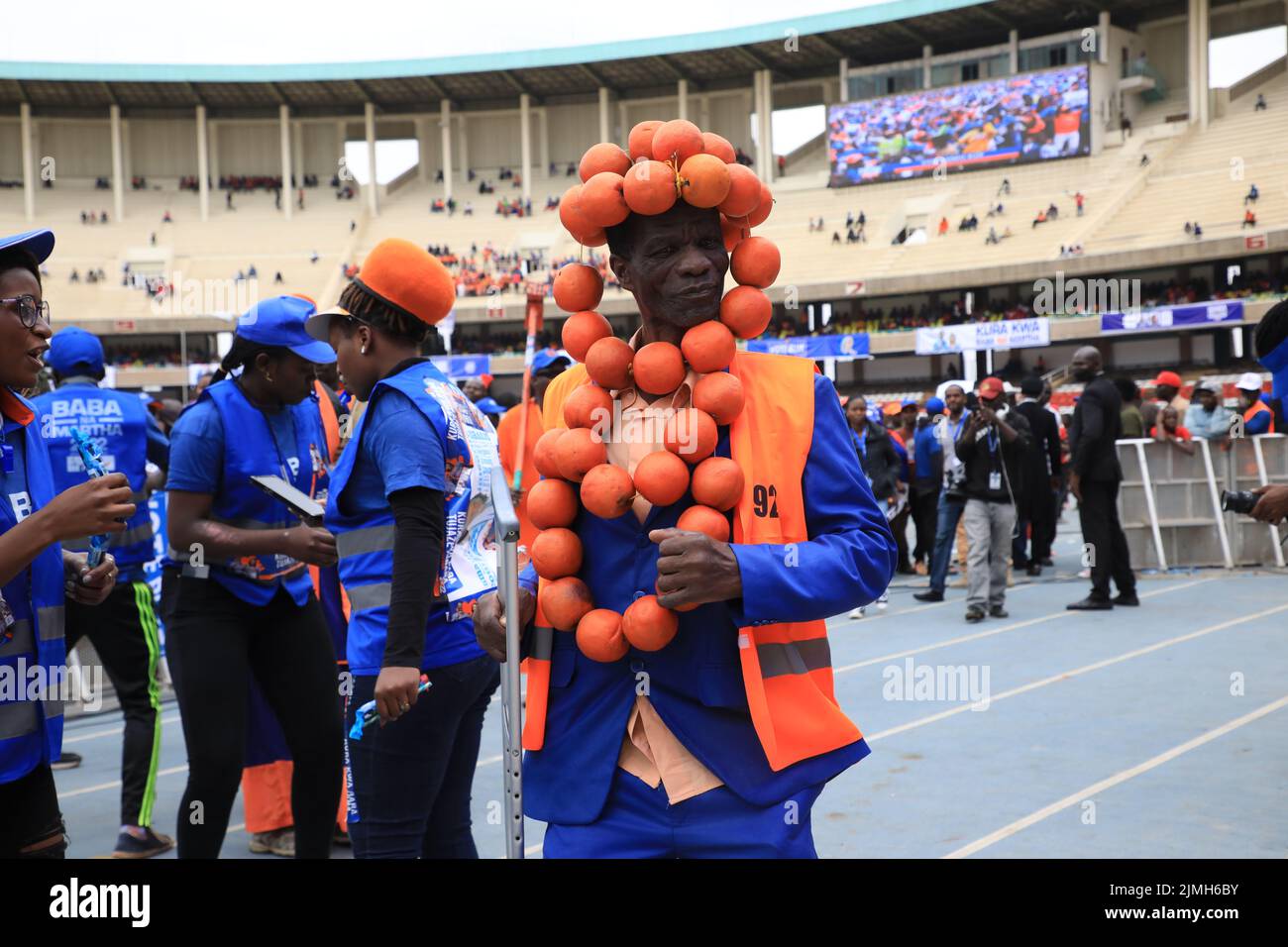 Nairobi, Kenya. 06th Aug, 2022. A supporter of Azimio la Umoja One Kenya presidential candidate Raila Odinga, dressed in orange dances during the final day of campaigns at the Kasarani Stadium in Nairobi. The August 9, 2022 general elections will be his fifth attempt at the presidency. Credit: SOPA Images Limited/Alamy Live News Stock Photo