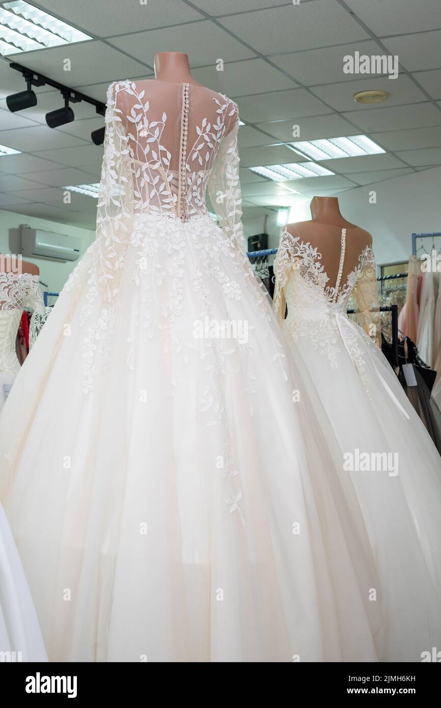 Beautiful bride's dress, rear view. Wedding dress shop Stock Photo