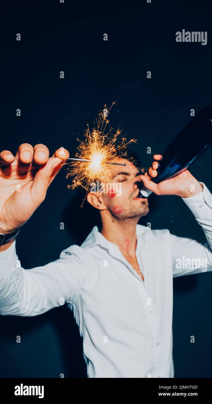 new year party wasted guy lipstick kisses drinking Stock Photo
