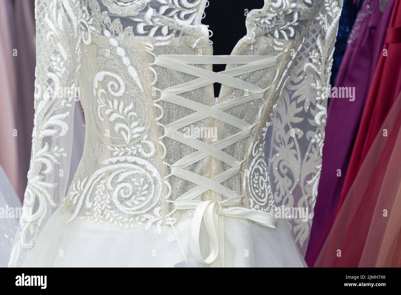 Lace on a white wedding dress close-up Stock Photo