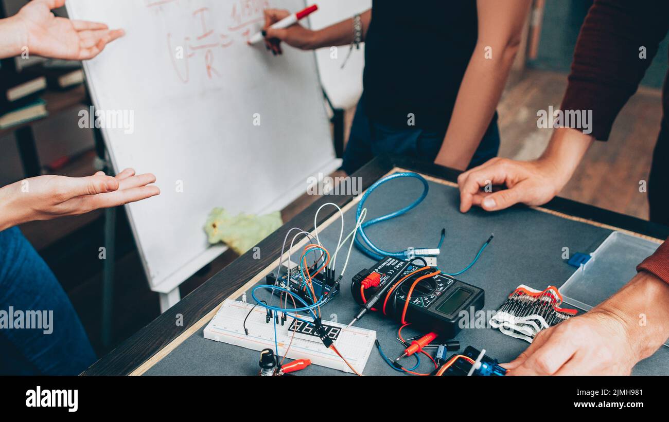 scientists teamwork electronic device project Stock Photo Alamy