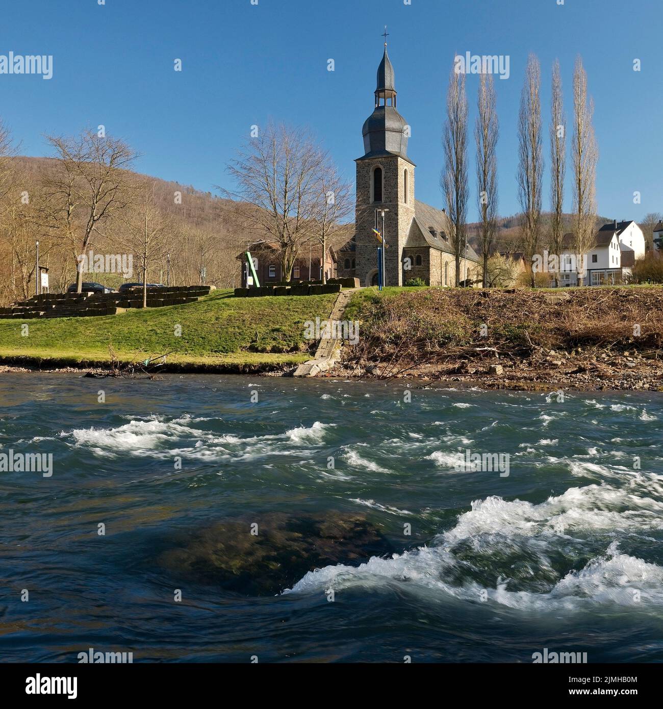 The River Lenne with the Church of St. Josef in Nachrodt, Nachrodt-Wiblingwerde, Germany, Europe Stock Photo