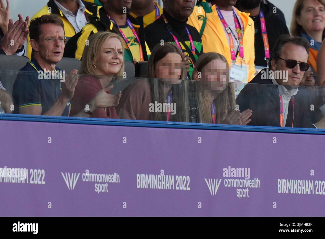 EDITORS NOTE Children's faces have been pixelated as the PA Picture Desk has been unable to gain the necessary permission to photograph a child under 16. Liz Truss with West Midlands Mayor Andy Street (left) at Alexander Stadium to watch the athletics, with her daughters Frances, 16, and Liberty, 13, and husband Hugh O'Leary on day nine of the 2022 Commonwealth Games in Birmingham. Picture date: Saturday August 6, 2022. Stock Photo