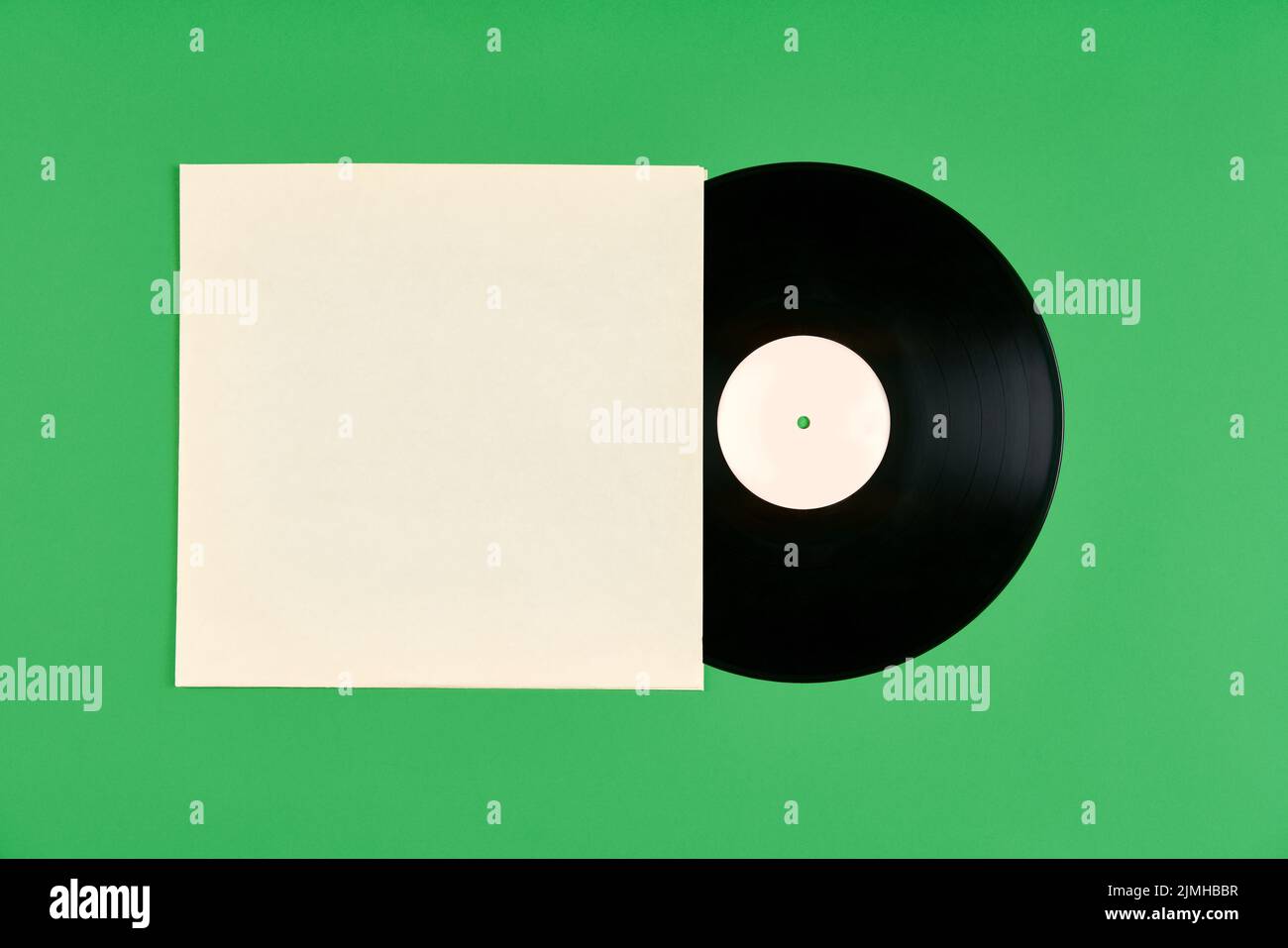 Vinyl record with cover mockup isolated over green background Stock Photo