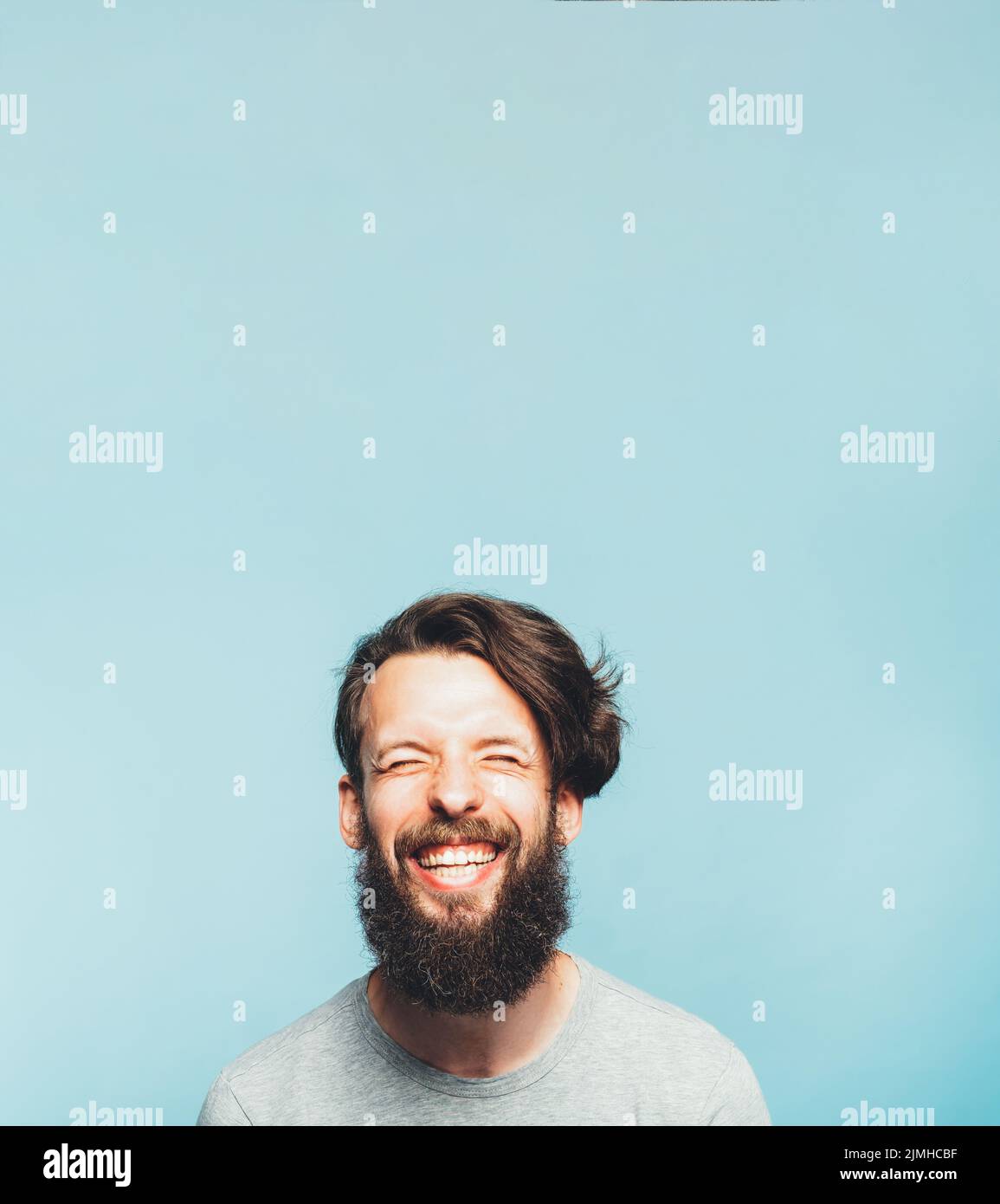 exhilarated bearded hipster happy feeling emotion Stock Photo