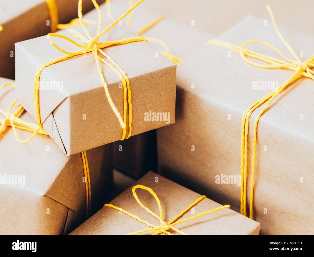 online shopping sale pile beige boxes yellow cord Stock Photo