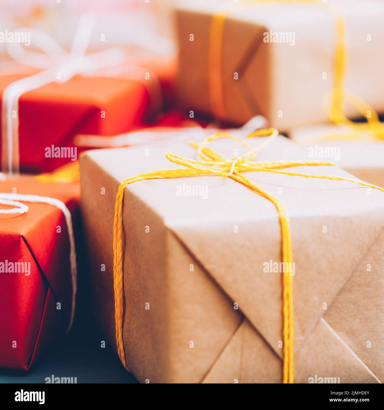 holiday shopping sale beige red gift boxes pile Stock Photo